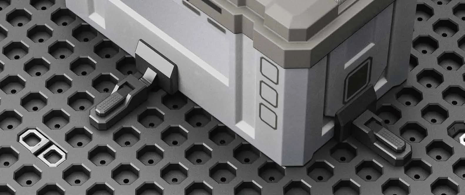 Cargo blocker positioned beside a storage box on the grid mat