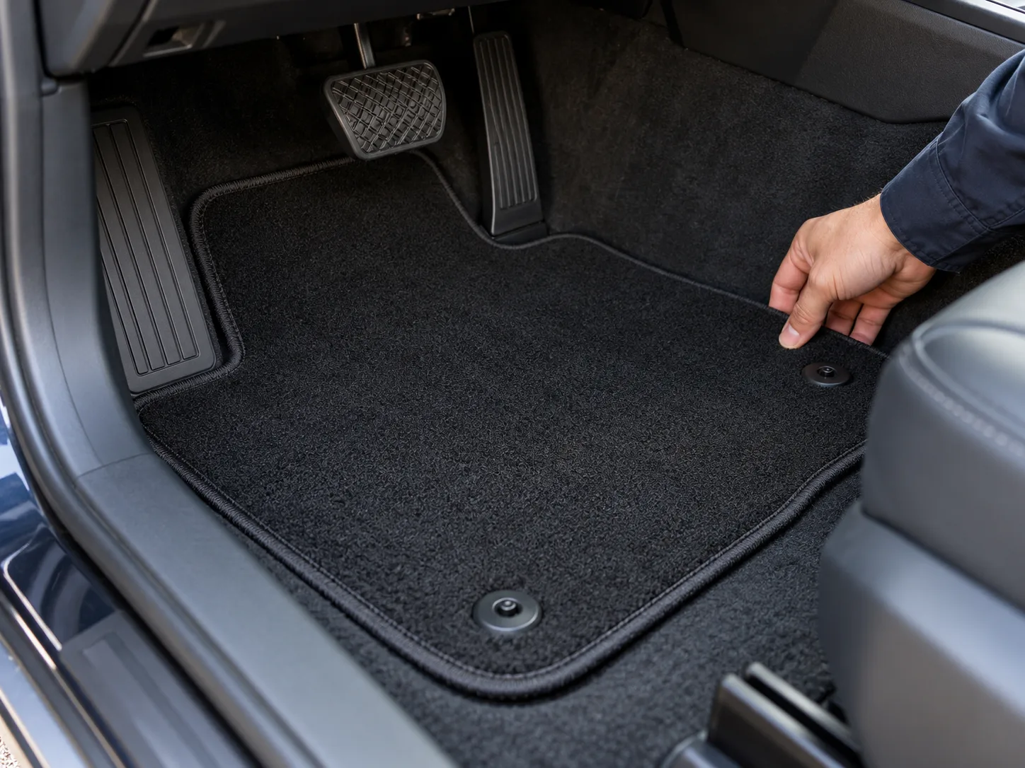 Illustrative inspection of a car floor mat near retention points