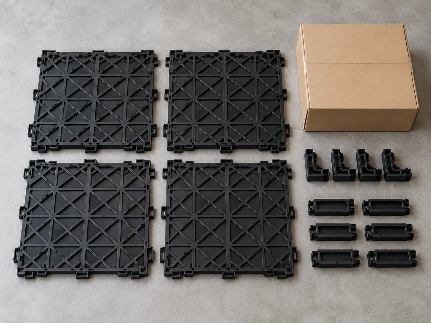Illustrative modular truck bed mat panels and accessories laid out for inspection