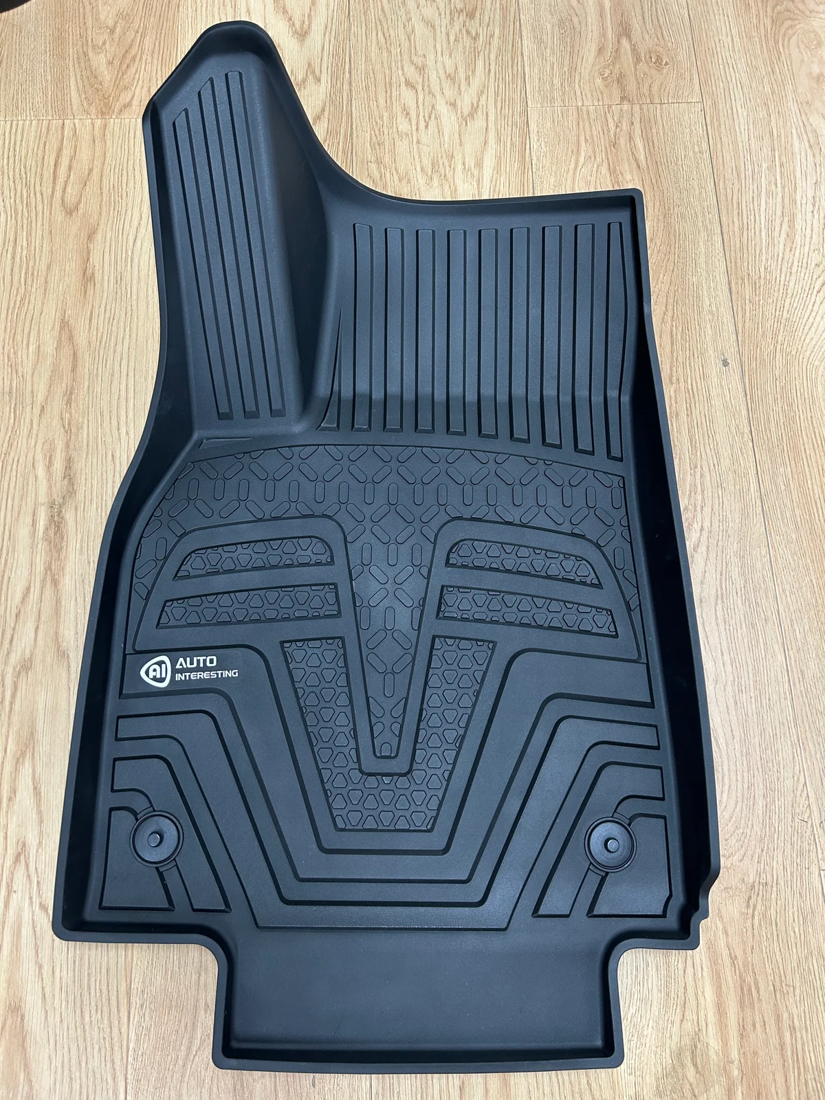 Provided photo of a black molded front floor mat